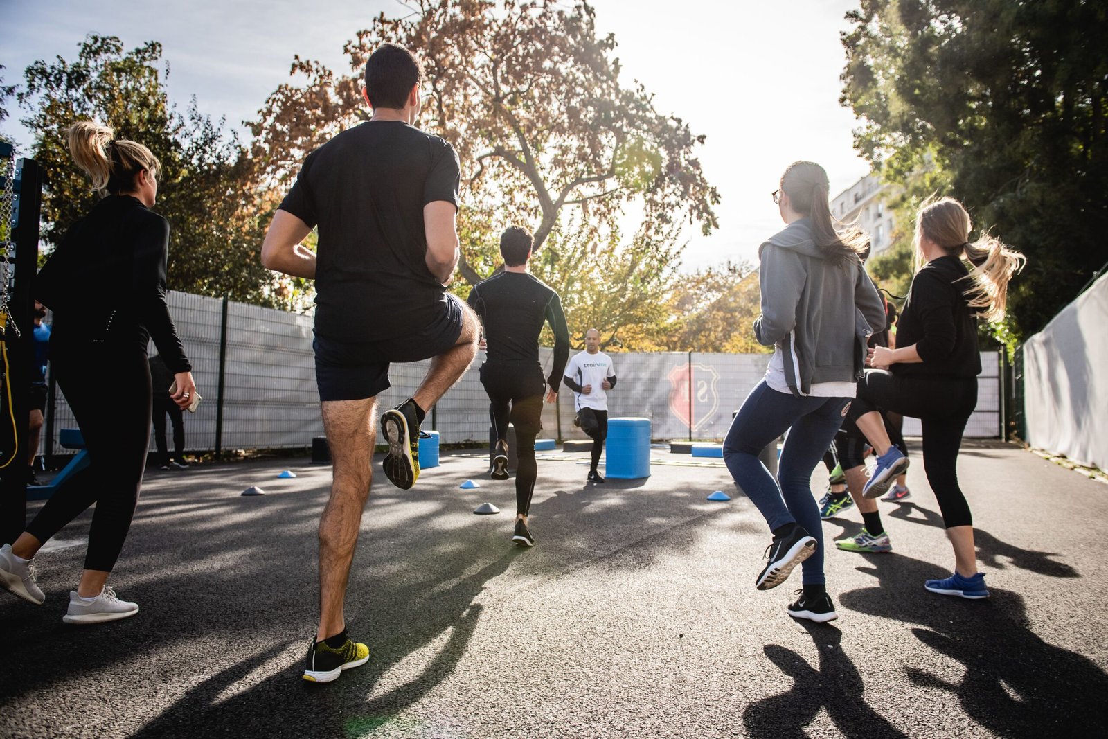 A group of people working out together towards better health and fitness, mind, body and soul
