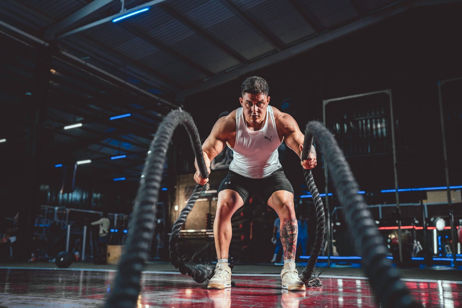 Person strength training with focus to improve physical performance, resilience, and nervous system regulation